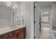Bathroom features vanity, storage, mirror, and ensuite bathroom at 4008 Quintessa Dr, Matthews, NC 28104