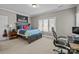 Bedroom featuring a bed, a study desk, and a window allowing plenty of natural light in at 4008 Quintessa Dr, Matthews, NC 28104