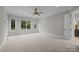 This spacious bedroom features large windows and neutral decor for a bright, inviting atmosphere at 4008 Quintessa Dr, Matthews, NC 28104