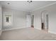 Bedroom features neutral carpet, large window, and ensuite bathroom at 4008 Quintessa Dr, Matthews, NC 28104