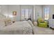 Bright bedroom featuring a white bed frame, a cozy reading chair, and a study desk near the window at 4008 Quintessa Dr, Matthews, NC 28104