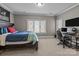 Bedroom featuring a bed, a study desk, and a window allowing plenty of natural light in at 4008 Quintessa Dr, Matthews, NC 28104