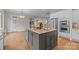 Spacious kitchen with center island, stainless appliances, and access to living area at 4008 Quintessa Dr, Matthews, NC 28104