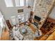 Aerial view of bright living room with stone fireplace, hardwood floors, and oversized windows at 4008 Quintessa Dr, Matthews, NC 28104