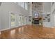 Open living room with a stone fireplace and built-in bookshelves at 4008 Quintessa Dr, Matthews, NC 28104