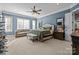 Large primary bedroom with a couch, bench, and large windows at 4008 Quintessa Dr, Matthews, NC 28104