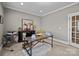 Office with carpeted floors, a large window, a desk, a cow artwork, and an office chair at 4008 Quintessa Dr, Matthews, NC 28104