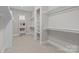 This walk-in closet features ample shelving and storage space for organizing clothes and accessories at 4008 Quintessa Dr, Matthews, NC 28104