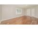 Bedroom with hardwood floors and two windows offering natural light at 401 Pine St, Fort Mill, SC 29715