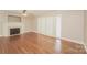 Spacious living room featuring hardwood floors and a fireplace at 401 Pine St, Fort Mill, SC 29715