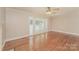 Bright living room with hardwood floors, fireplace, and sliding doors at 401 Pine St, Fort Mill, SC 29715