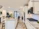 Open kitchen with island, granite countertops, white cabinets at 4084 Skyboat Cir, Fort Mill, SC 29715