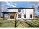 Backyard view of two-story home and covered patio with outdoor fire pit at 4605 Western Union School Rd, Waxhaw, NC 28173