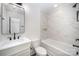 Modern bathroom with white vanity, black fixtures, and a stylish, tiled shower/tub combination at 4605 Western Union School Rd, Waxhaw, NC 28173