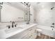 Stylish bathroom with double vanity, modern fixtures, and marble-like tile for a luxurious feel at 4605 Western Union School Rd, Waxhaw, NC 28173