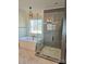 Luxurious bathroom with soaking tub, glass-enclosed shower, contemporary fixtures, and modern lighting at 4605 Western Union School Rd, Waxhaw, NC 28173