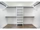 Walk-in closet with custom shelving and a ladder for easy access to upper storage areas at 4605 Western Union School Rd, Waxhaw, NC 28173