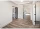 Bright entryway with a gray accent door to the bathroom and wood-look flooring at 4605 Western Union School Rd, Waxhaw, NC 28173