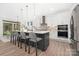 Bright, modern kitchen with white cabinets, a black island, and stainless steel appliances at 4605 Western Union School Rd, Waxhaw, NC 28173
