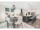 Open kitchen and dining area featuring modern light fixtures and white cabinetry at 4605 Western Union School Rd, Waxhaw, NC 28173