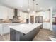 Gorgeous kitchen featuring a large island with quartz countertop, modern appliances, and stylish fixtures at 4605 Western Union School Rd, Waxhaw, NC 28173