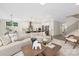 Open-concept living room with modern furniture and an open view to the kitchen with a large island at 4605 Western Union School Rd, Waxhaw, NC 28173