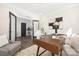 Bright office with a mid-century modern desk, stylish decor, and a cozy seating area at 4605 Western Union School Rd, Waxhaw, NC 28173