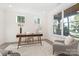 Bright office with a mid-century modern desk, stylish decor, and a large window at 4605 Western Union School Rd, Waxhaw, NC 28173