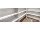 Walk-in pantry with ample shelving and wood-look flooring at 4605 Western Union School Rd, Waxhaw, NC 28173