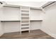 Spacious walk-in closet with white shelving and black rods in an ample storage room at 4605 Western Union School Rd, Waxhaw, NC 28173
