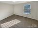 Simple bedroom with carpet and one window at 4903 Greenloch Ct, Monroe, NC 28110