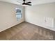 Bright bedroom with neutral walls, ceiling fan, and carpet at 4903 Greenloch Ct, Monroe, NC 28110