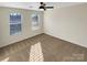 Well-lit bedroom with carpet and two windows at 4903 Greenloch Ct, Monroe, NC 28110