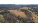 Aerial view of property showcasing the home and surrounding land at 499 Indian Hill Rd, Olin, NC 28660