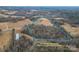 Aerial view of property showing home, outbuildings, and large lot at 499 Indian Hill Rd, Olin, NC 28660