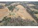 Aerial view of a rural property with multiple buildings at 499 Indian Hill Rd, Olin, NC 28660