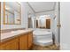 Bathroom features a garden tub and double vanity at 499 Indian Hill Rd, Olin, NC 28660