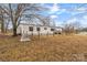 Mobile home exterior with fenced yard at 499 Indian Hill Rd, Olin, NC 28660