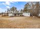 White mobile home with green roof and covered deck at 499 Indian Hill Rd, Olin, NC 28660