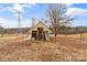 Wooden goat shed in a fenced area at 499 Indian Hill Rd, Olin, NC 28660