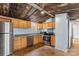 Modern kitchen features stainless steel appliances and rustic tin ceiling at 499 Indian Hill Rd, Olin, NC 28660