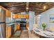 Kitchen with wood cabinets, stainless steel appliances, and tile floor at 499 Indian Hill Rd, Olin, NC 28660