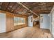 Living room with hardwood floors and rustic tin ceiling at 499 Indian Hill Rd, Olin, NC 28660