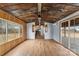 Living room with hardwood floors and rustic tin ceiling at 499 Indian Hill Rd, Olin, NC 28660