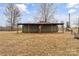 Large green storage shed with covered parking area at 499 Indian Hill Rd, Olin, NC 28660