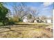 Wide-open backyard with sheds and trees for shade, providing space for outdoor enjoyment at 505 Kings Mountain St, Clover, SC 29710