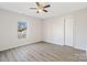 Bright bedroom featuring a window that provides natural light and sleek wood-look floors at 505 Kings Mountain St, Clover, SC 29710