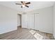 This bedroom has sleek wood-look floors, neutral walls, and a convenient ceiling fan at 505 Kings Mountain St, Clover, SC 29710