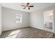 Bedroom featuring gray laminate flooring, a window, and neutral paint at 505 Kings Mountain St, Clover, SC 29710