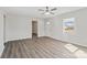 Open-concept living area featuring gray laminate floors and neutral paint at 505 Kings Mountain St, Clover, SC 29710